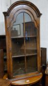 A Queen Anne Revival walnut corner cupboard. With key, excellent condition.