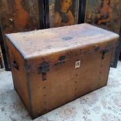 A substantial 19th century French metal bound chateau trunk, cartouche shaped makers plaque reads '