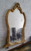 A substantial giltwood over mantel mirror
