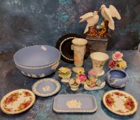 A Wedgwood blue Jasperware bowl, typically sprigged in white, impressed marks;  other trinket