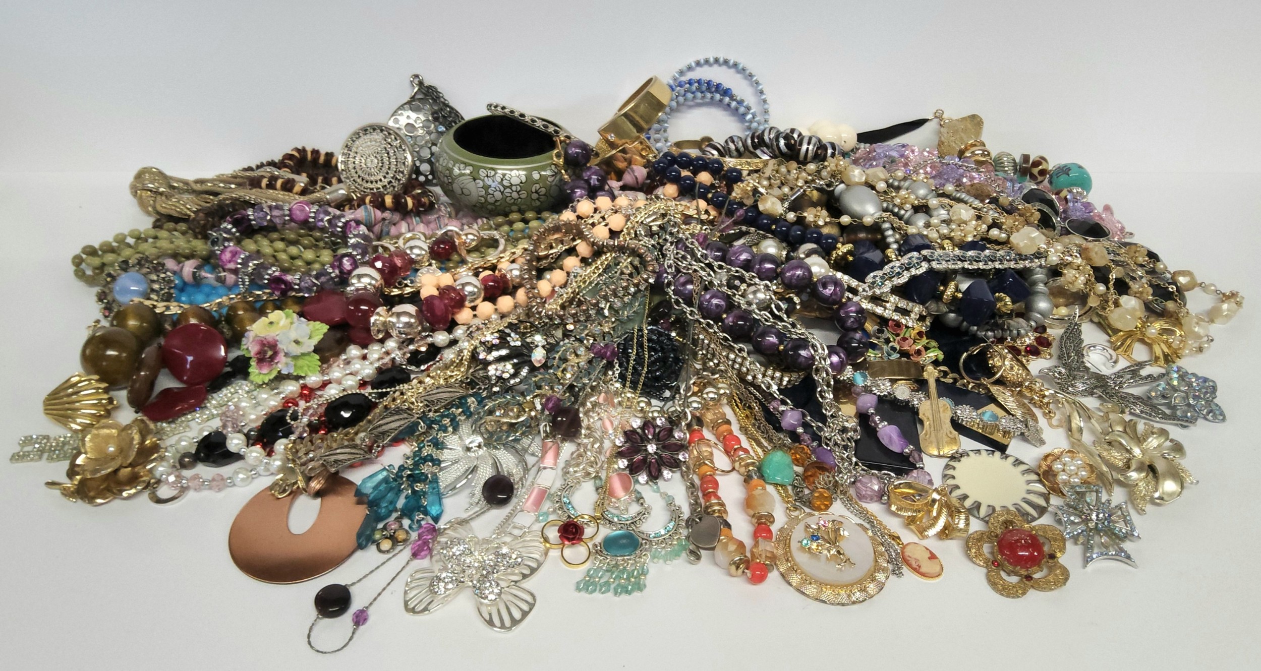 Costume jewellery including beads, necklaces, bracelets and brooches etc.