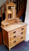 An early 20th century farmhouse pine dressing chest, oversized pressed copper escutcheons c.1910