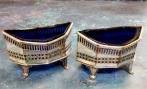 A pair of Victorian Sheffield Plate octagonal salts, pierced sides, blue glass liners, 9cm wide, c.