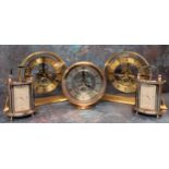 A chrome oval carriage clock, quartz movment, swing handle, raised on four feet, NOS in original