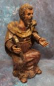A '17th century' Continental painted softwood figure, Moses, seated, holding a tablet, 44cm high