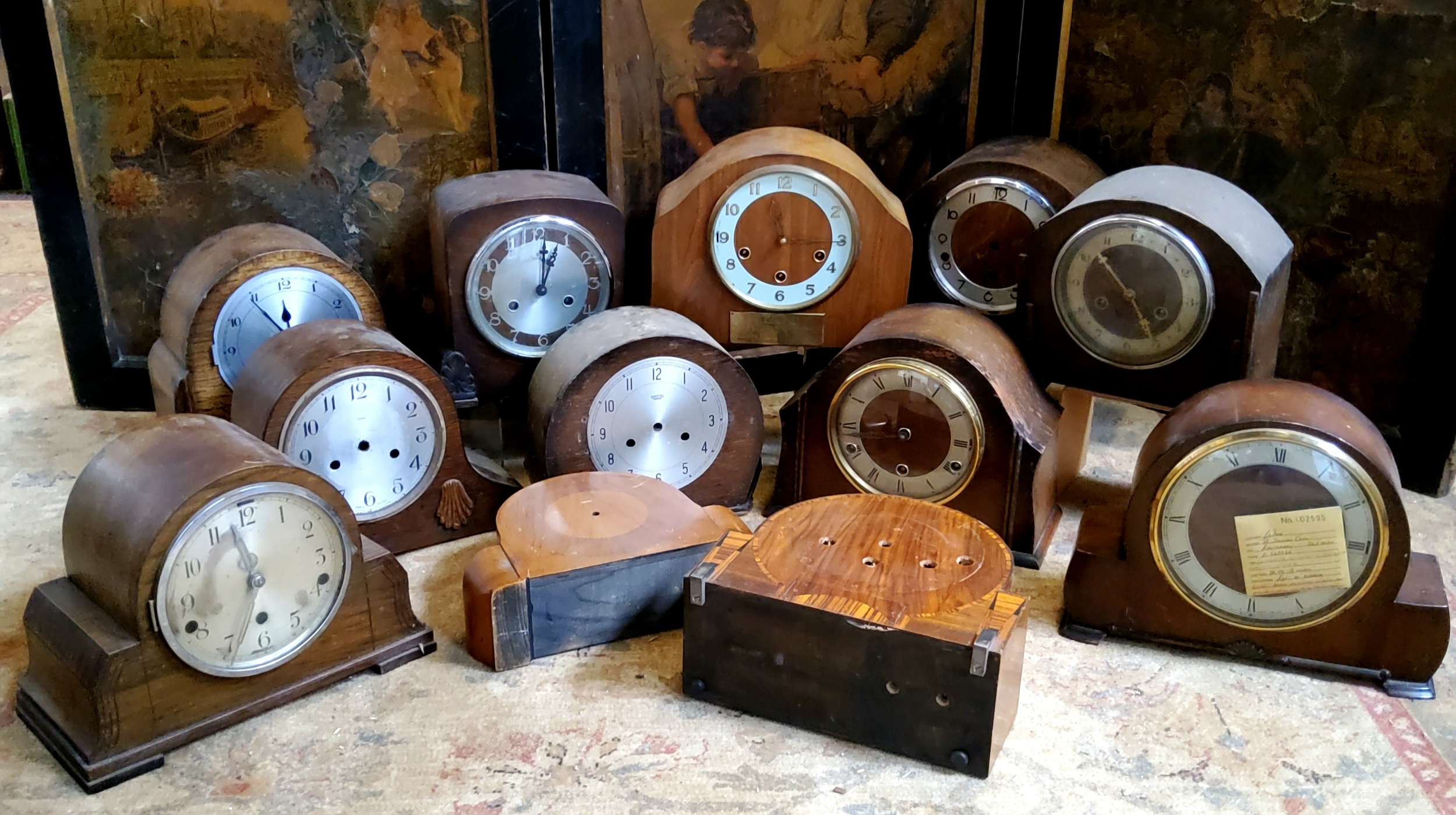 Twelve early 20th century oak, walnut and mahogany mantel clocks (for restoration)