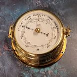 A brass Shatz porthole Precison barometer,  14.5cms diam