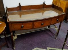 A Regency mahogany dressing table, ebony stringing c.1820, protective toughened glass cover.