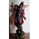 A very large Spanish carved wood polychrome painted figure of Saint Michael The Archangel slaying