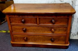 A Victorian flamed mahogany chest of two short above two long drawers, plinth base, low proportions.