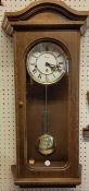 A German Windsor oak finish Wall Clock by Zeit.Punkt, regulator movement, 4/4 Westminster chime, H65