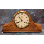 A Britains Clock Co. Napolean Hat mantel clock, walnut finish, cream dial, black Roman numerals,