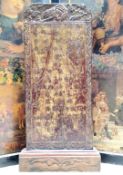 A Chinese canted rectangular calligraphy panel, carved with flowerheads, blossoming prunus and