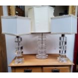 A pair of 20th century century Perspex stacked cube design lamp bases, cream shades, 42cm high;