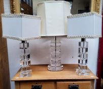 A pair of 20th century century Perspex stacked cube design lamp bases, cream shades, 42cm high;