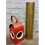 A Kenyon's Kenlite road lamp, red painted;  a large shell case (2)