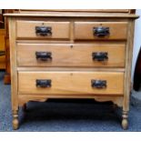 An Arts & Crafts stripped chest of two short over two long drawers, oversized beaten metal