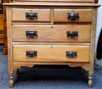 An Arts & Crafts stripped chest of two short over two long drawers, oversized beaten metal