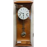 A contemporary Hermle Regulator Wall Clock, Beech finish, 8 Day Movement 4/4 Westminister chime,