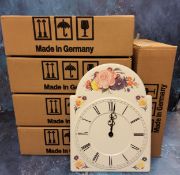 A decorative pressed metal wall clock, quartz, in the form of a grandfather clock dial, quartz