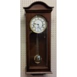 A Fox & Simpson mahogany finish wall clock, 8 day movement, 4/4 chime, automatic night shut off,