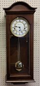 A Fox & Simpson mahogany finish wall clock, 8 day movement, 4/4 chime, automatic night shut off,