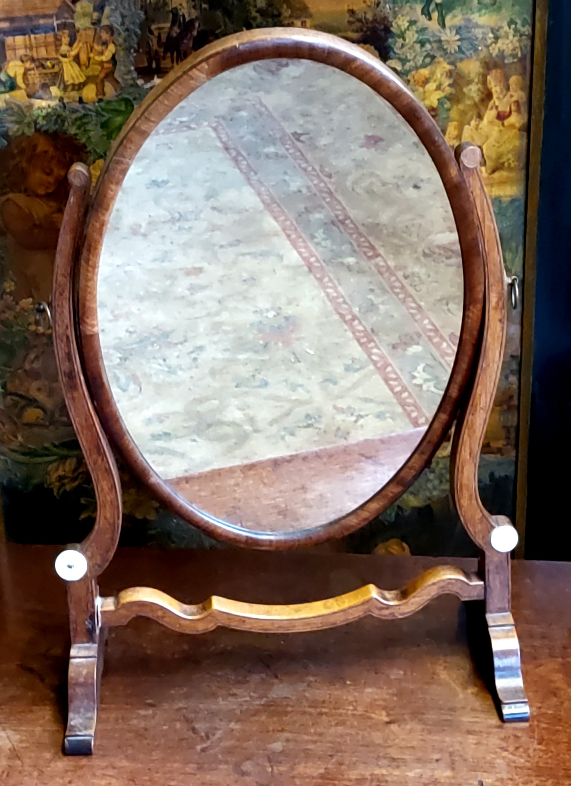 A George III oval dressing table mirror c.1800, Scandinavian pine back panel with flamed mahogany