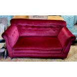 A Victorian country house drop arm two seater 'Knowle' sofa, deep button backed merlot coloured