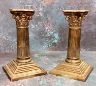 A pair of silver Corinthian column candlesticks, stoop fluted columns, stepped bases, 15.5cm high,