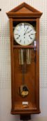 A Hermle & Sohn yew wall clock, regulator, 4/4 Westminster chime (time side cable driven, chime