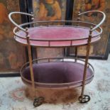 WITHDRAWN - A gilt metal mounted two tier drinks trolley