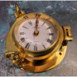 A Solent solid brass porthole clock, screw down hinged cover, quartz movement, NOS original