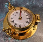 A Solent solid brass porthole clock, screw down hinged cover, quartz movement, NOS original