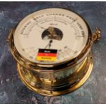 A Franz Hermle Brass Percision Barometer,  in the style of a ships port hole, NOS, with original