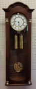 A Hermle Regulator Wall Clock, mahogany finish, 8 Day Movement 4/4 Westminister chime, weights,