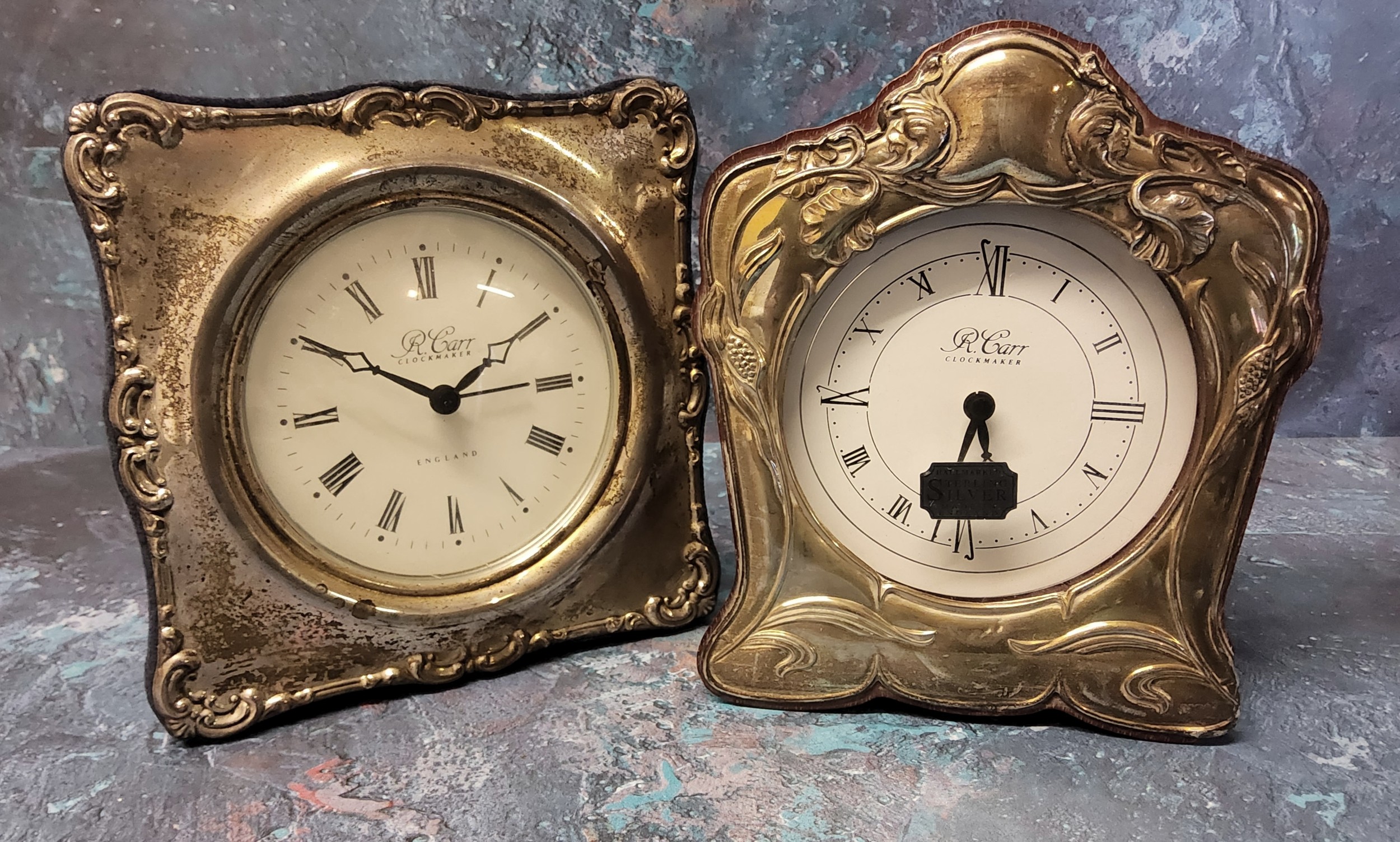 A silver mounted Art Nouveau style clock, silver panel embossed in relief with poppies, a vacant