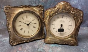 A silver mounted Art Nouveau style clock, silver panel embossed in relief with poppies, a vacant