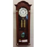 A Hermle Regulator Wall Clock, mahogany finish, 8 Day Movement 4/4 Westminister chime, weights,