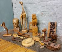 An African native wood bust, of an elder;  other native carvings;  an owl;  etc