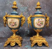 A pair of Louis XVI style gilt metal and porcelain pedestal ovoid side vase, decorated with