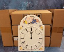 A decorative pressed metal wall clock, quartz, in the form of a grandfather clock dial, quartz