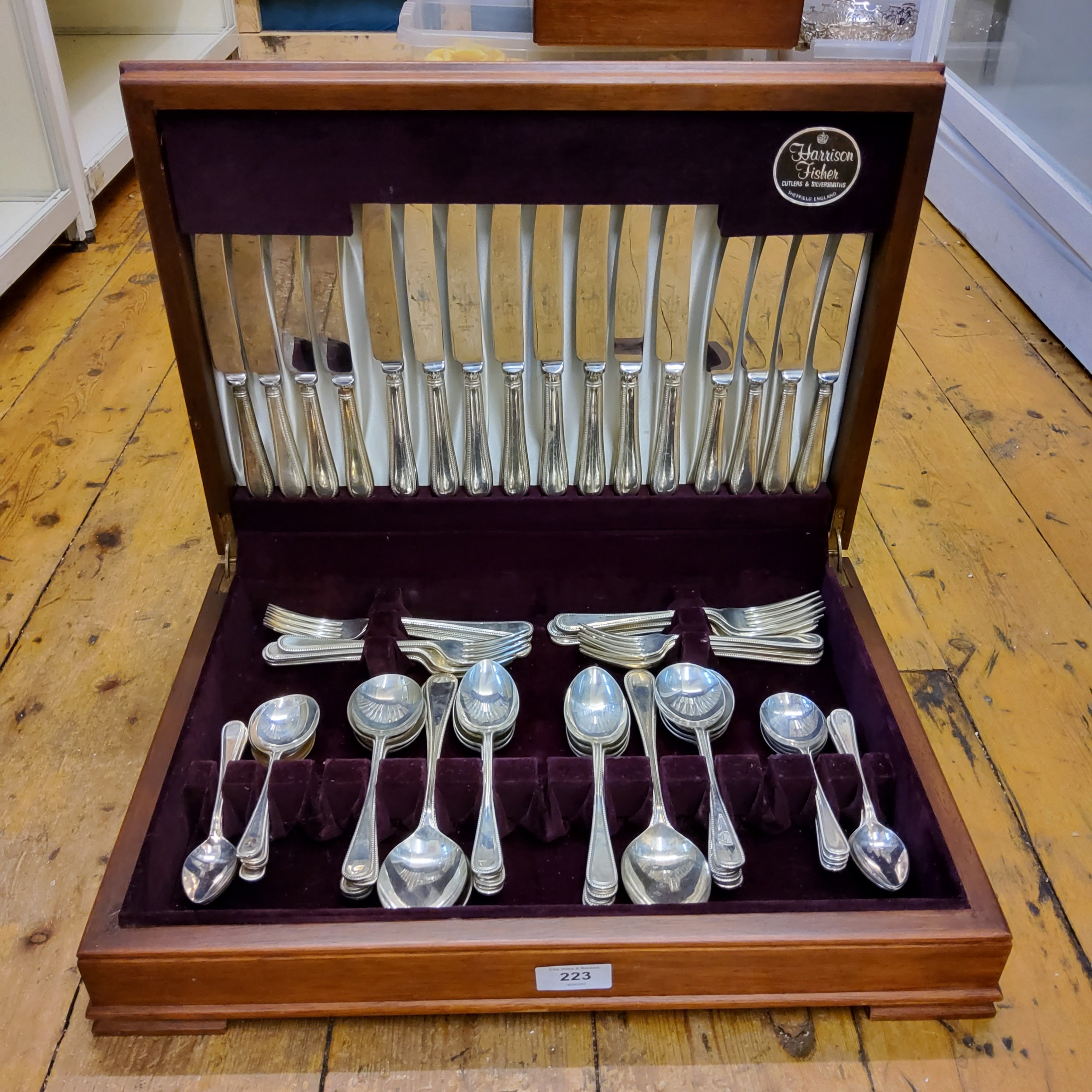A Harrison Fisher Beaded Old English pattern canteen, for eight, cased (four dessert knives lacking)