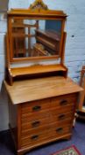 An Art Nouveau satinwood bedroom suite comprising of a dressing chest, single wardrobe and bed (3)