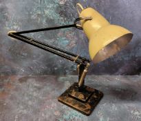 A Herbert Terry Anglepoise lamp - an early example finished in cream and black, weighted plinth