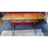 A Regency type sofa table, two short drawers to frieze, brass lion paw feet