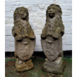 A good pair of reconstituted gritstone lions with shield