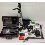 An Olympus IS300 camera;  Olympus B300 lens;  Sony Video camera;  tripod;  etc