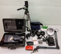 An Olympus IS300 camera;  Olympus B300 lens;  Sony Video camera;  tripod;  etc
