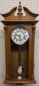 A Hermle Regulator Wall Clock, mahogany finish, 8 Day Movement 4/4 Westminister chime, pendulum, key