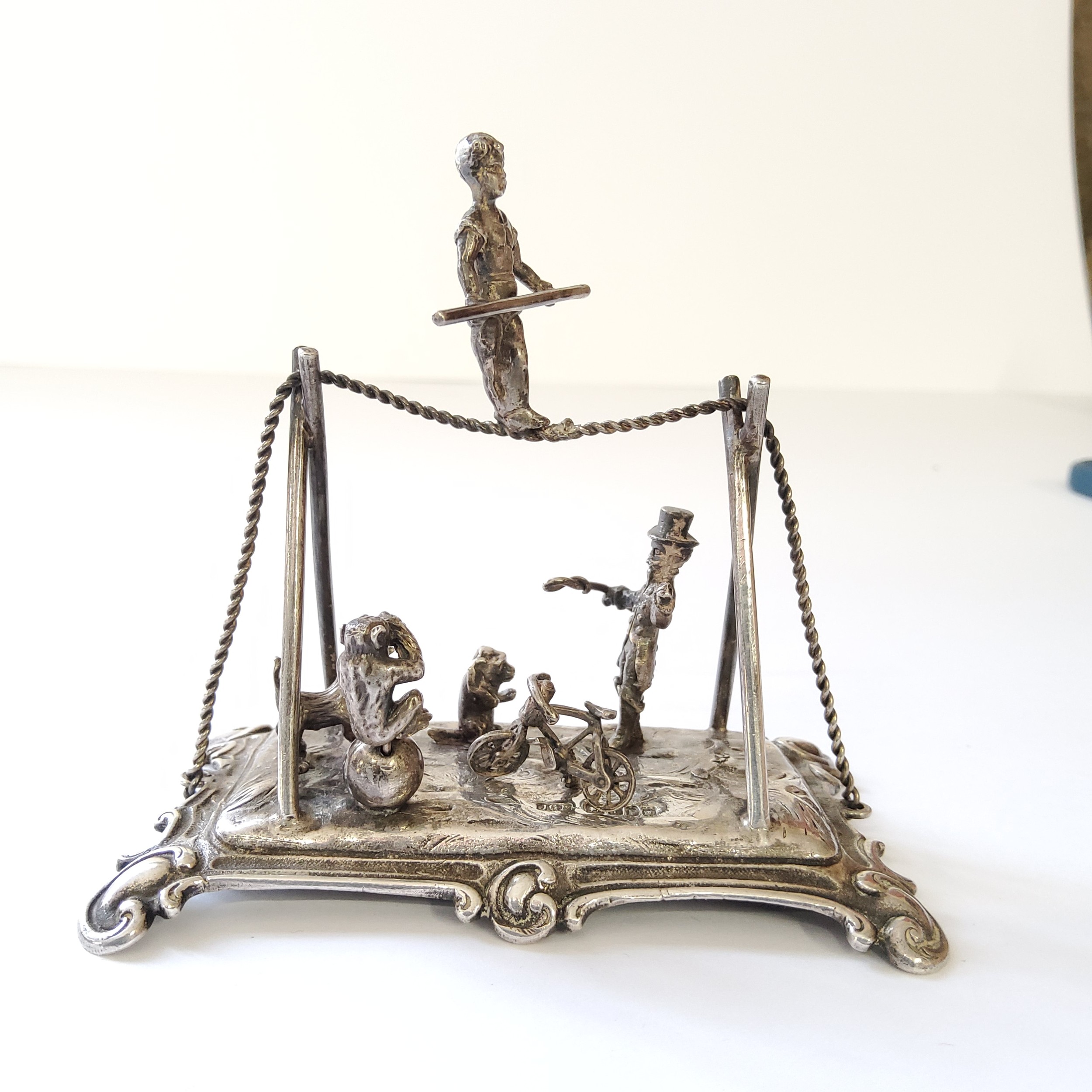 A good Dutch silver miniature diorama of a circus & ringmaster including trapeze artist, a